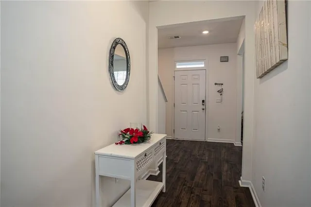 a dining room with a table and chairs