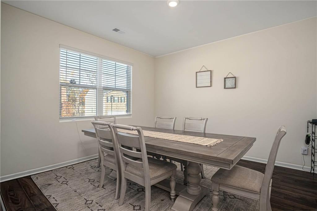 5381 Flat Rock Point Stonecrest, GA 30038 - Photo 10 of 53 a view of a dining room with furniture and wooden floor