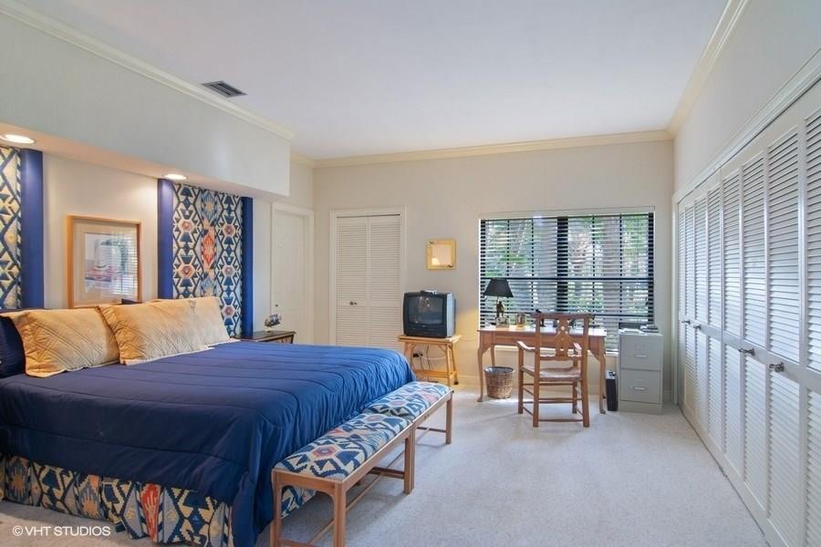 2160 Golfview Lane Stuart, FL 34996 - Photo 11 of 39 a bedroom with a bed and a large window