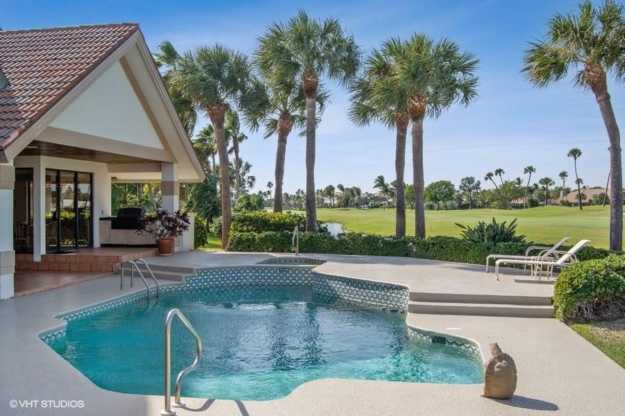 2160 Golfview Lane Stuart, FL 34996 - Photo 13 of 39 a view of a house with palm trees