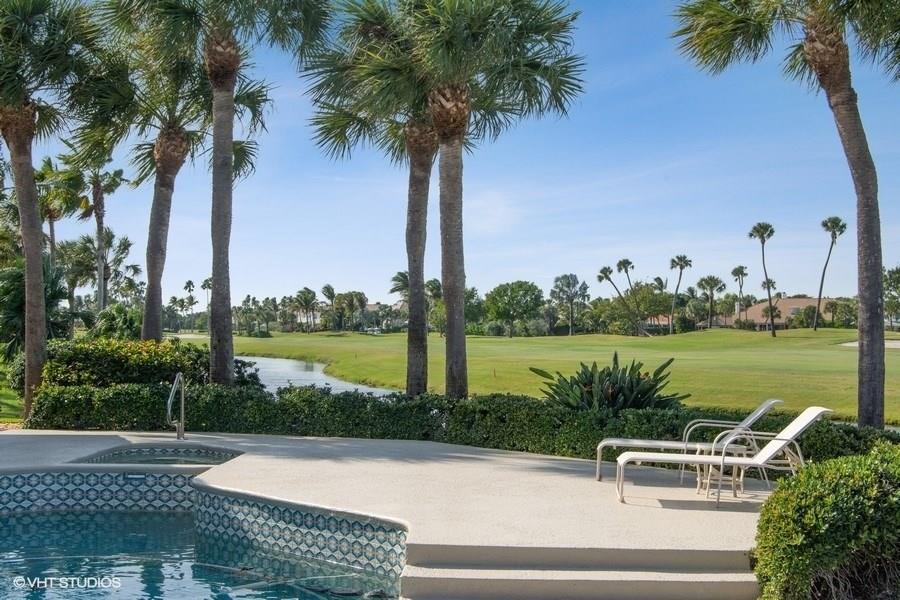 2160 Golfview Lane Stuart, FL 34996 - Photo 16 of 39 a view of a lake with couches in front of house