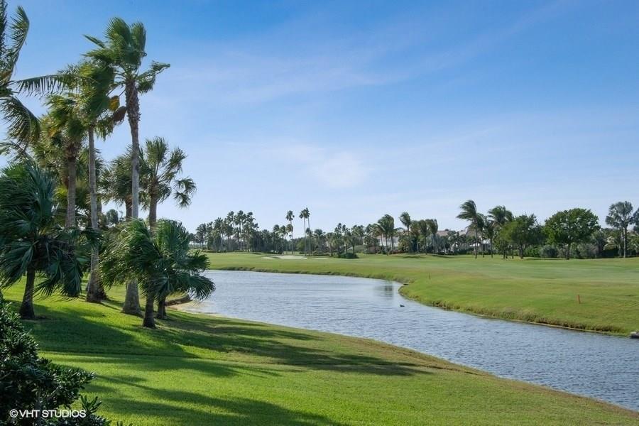2160 Golfview Lane Stuart, FL 34996 - Photo 17 of 39 a view of a golf course with a lake