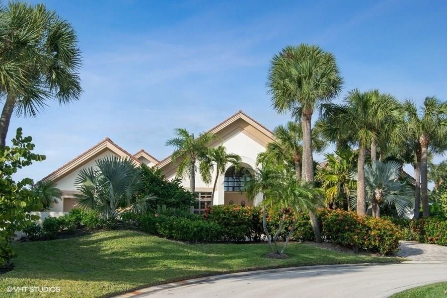 2160 Golfview Lane Stuart, FL 34996 - Photo 2 of 39 front view of a house with a tree