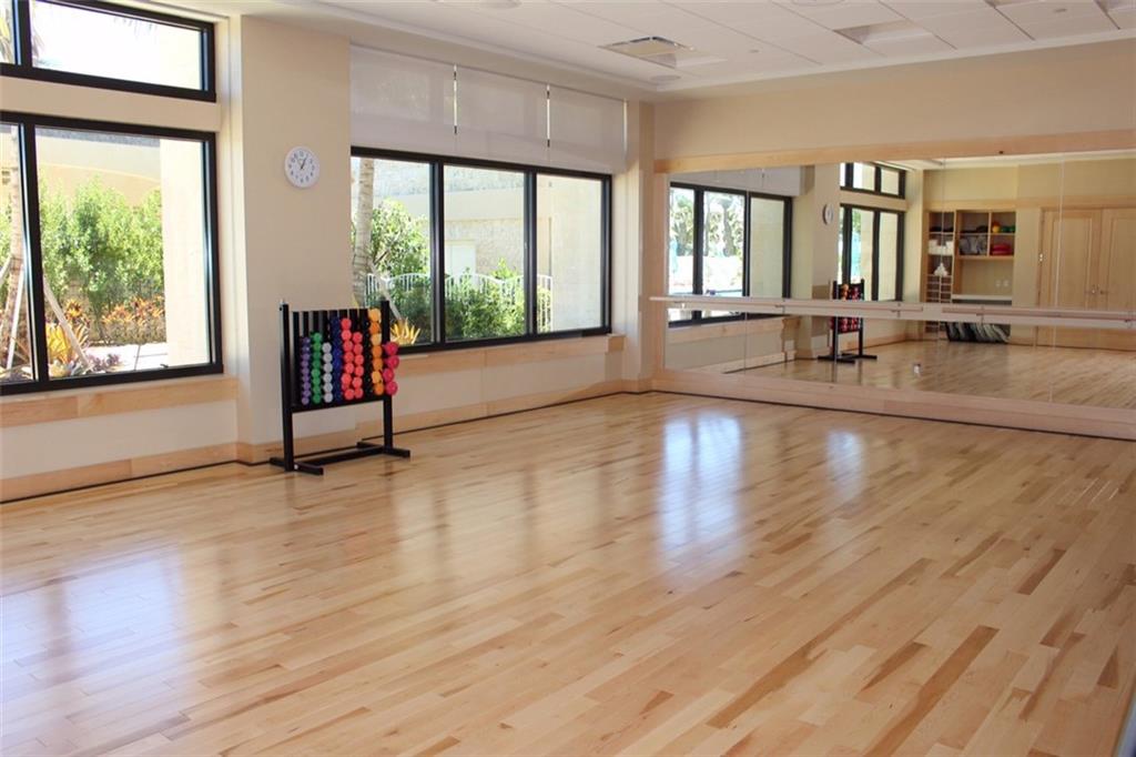 2160 Golfview Lane Stuart, FL 34996 - Photo 32 of 39 a view of a living room and kitchen with wooden floor