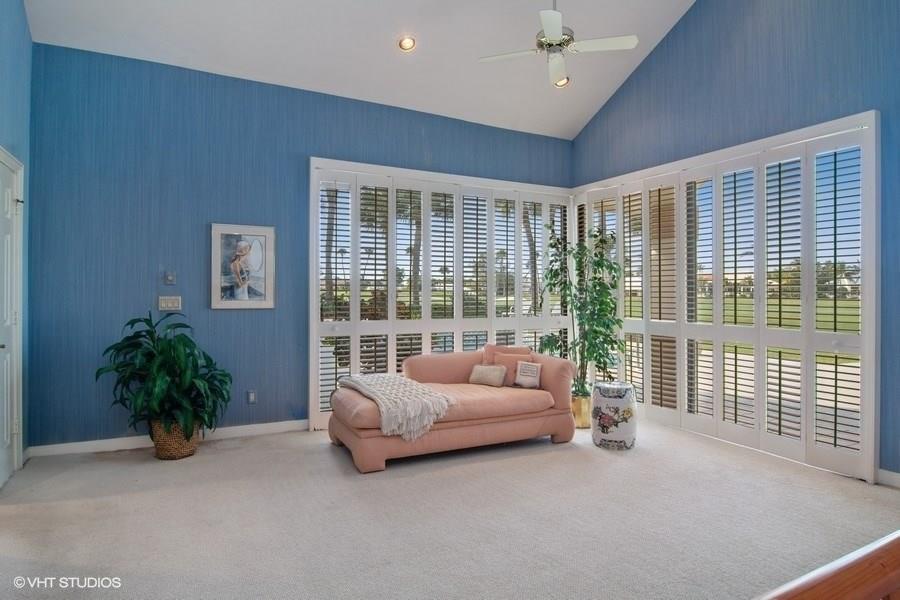 2160 Golfview Lane Stuart, FL 34996 - Photo 10 of 39 a living room with furniture and a potted plant
