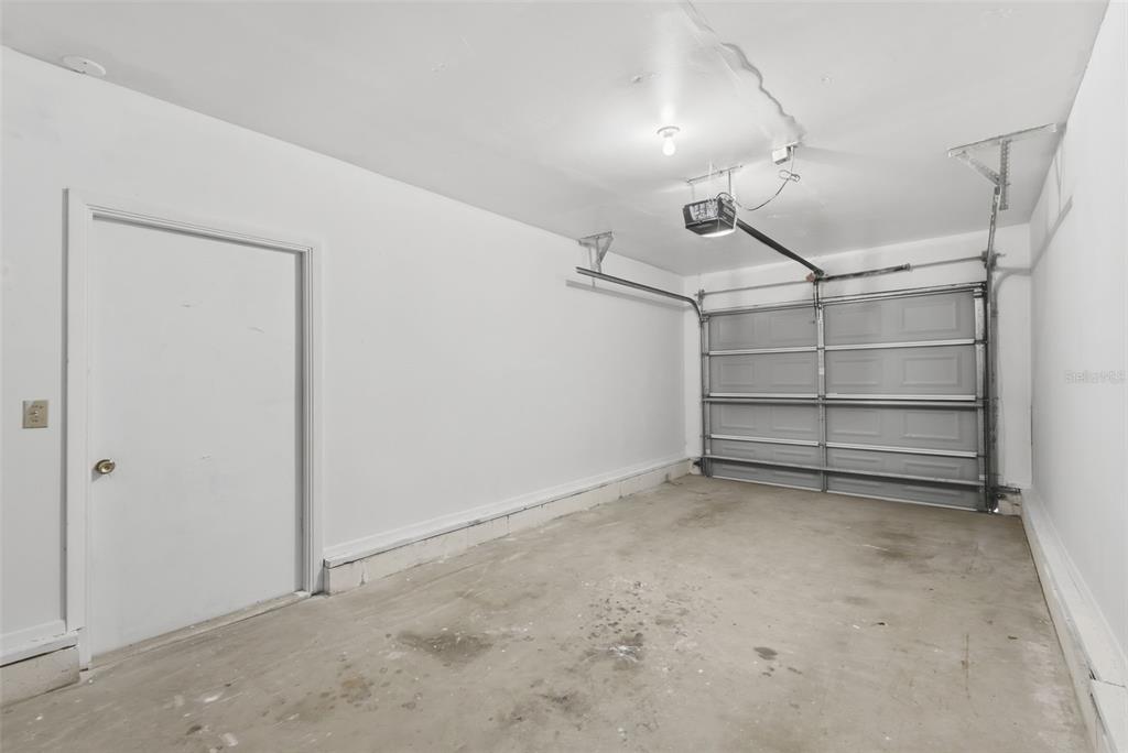 141 Spring Wind Way Casselberry, FL 32707 - Photo 19 of 32 a view of room that has a wooden floor and white walls