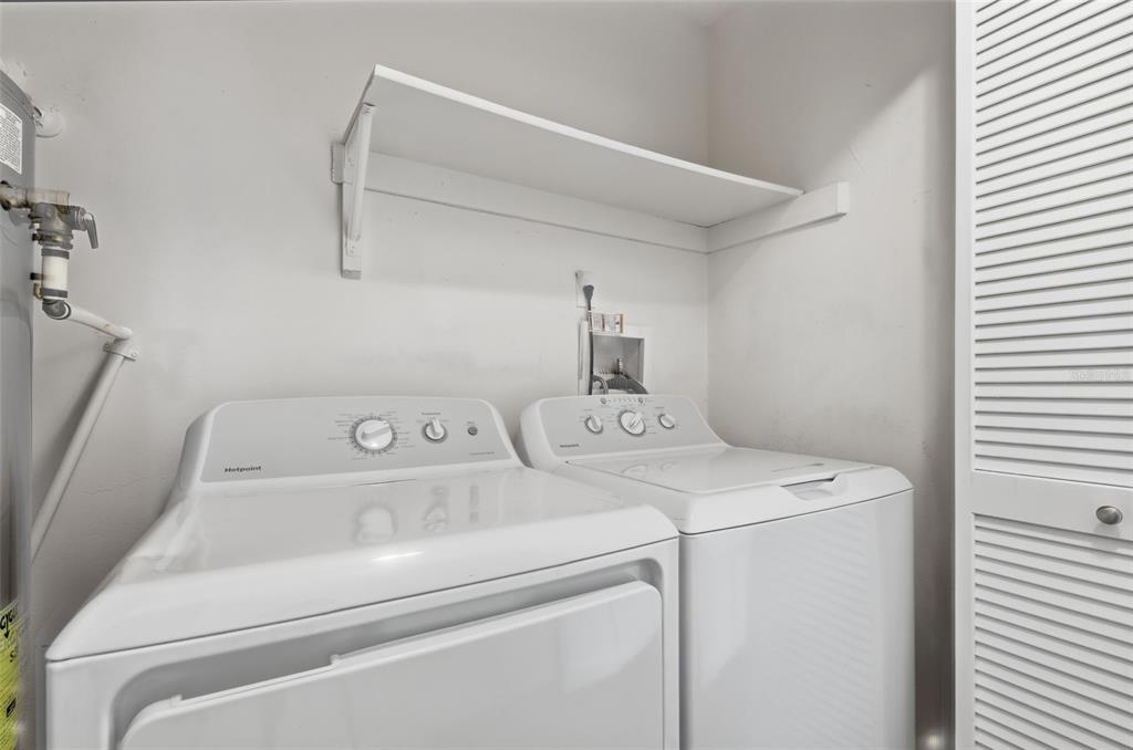 141 Spring Wind Way Casselberry, FL 32707 - Photo 26 of 32 a utility room with dryer and washer