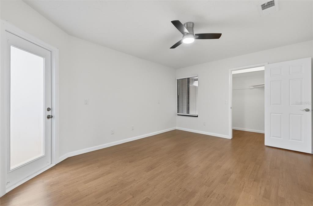 141 Spring Wind Way Casselberry, FL 32707 - Photo 6 of 32 a view of an empty room with wooden floor