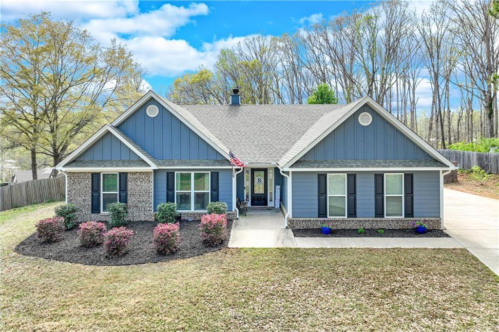 1101 Arch Tanner Road Bethlehem, GA 30620 - Photo 1 of 1 a view of a house with a yard and potted plants