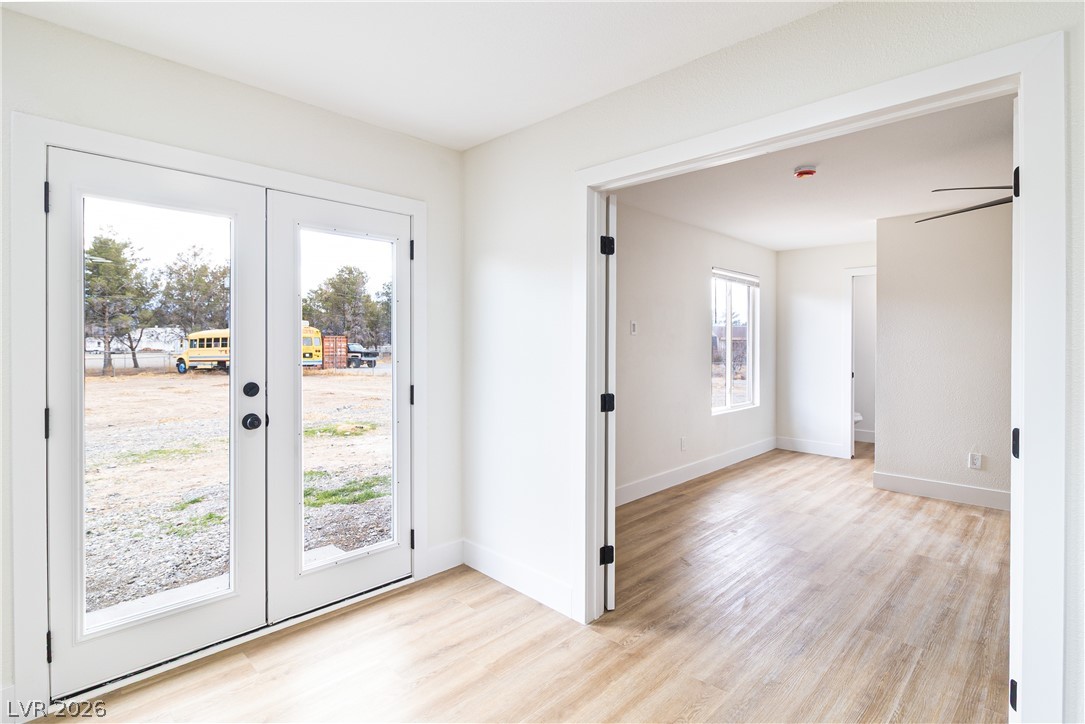 1891 Brian Road Pahrump, NV 89048 - Photo 13 of 50 Entryway with plenty of natural light, french doors, and light wood finished floors