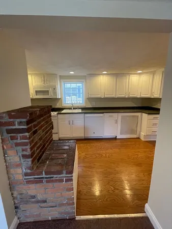 a kitchen with wooden cabinets and a sink