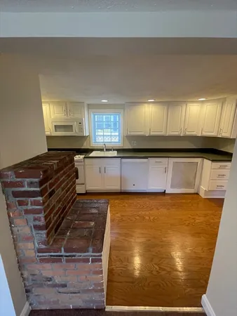 a kitchen with stainless steel appliances granite countertop a sink and cabinets