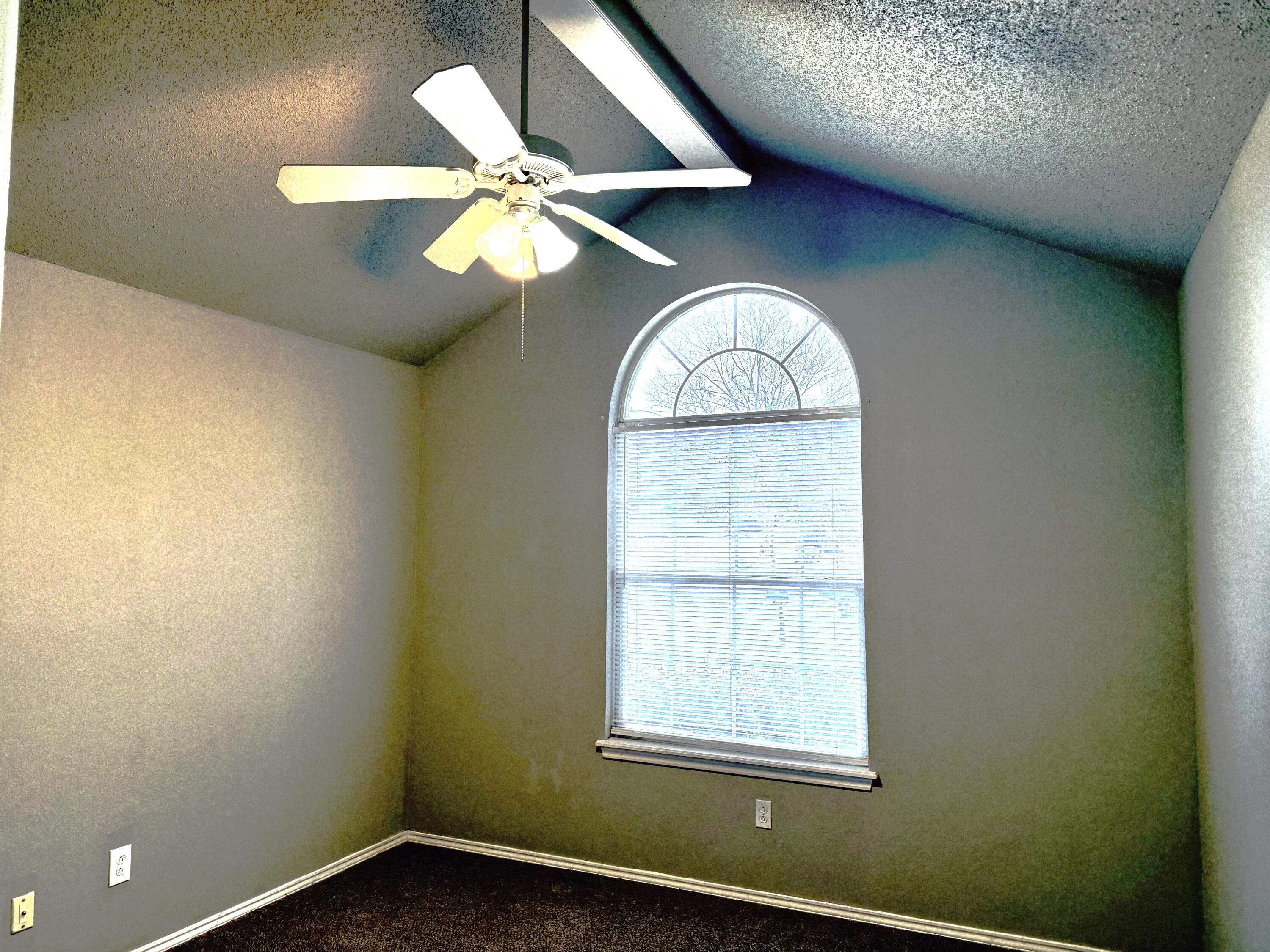 1918 75th Street Lubbock, TX 79423 - Photo 11 of 15 an empty room with a window