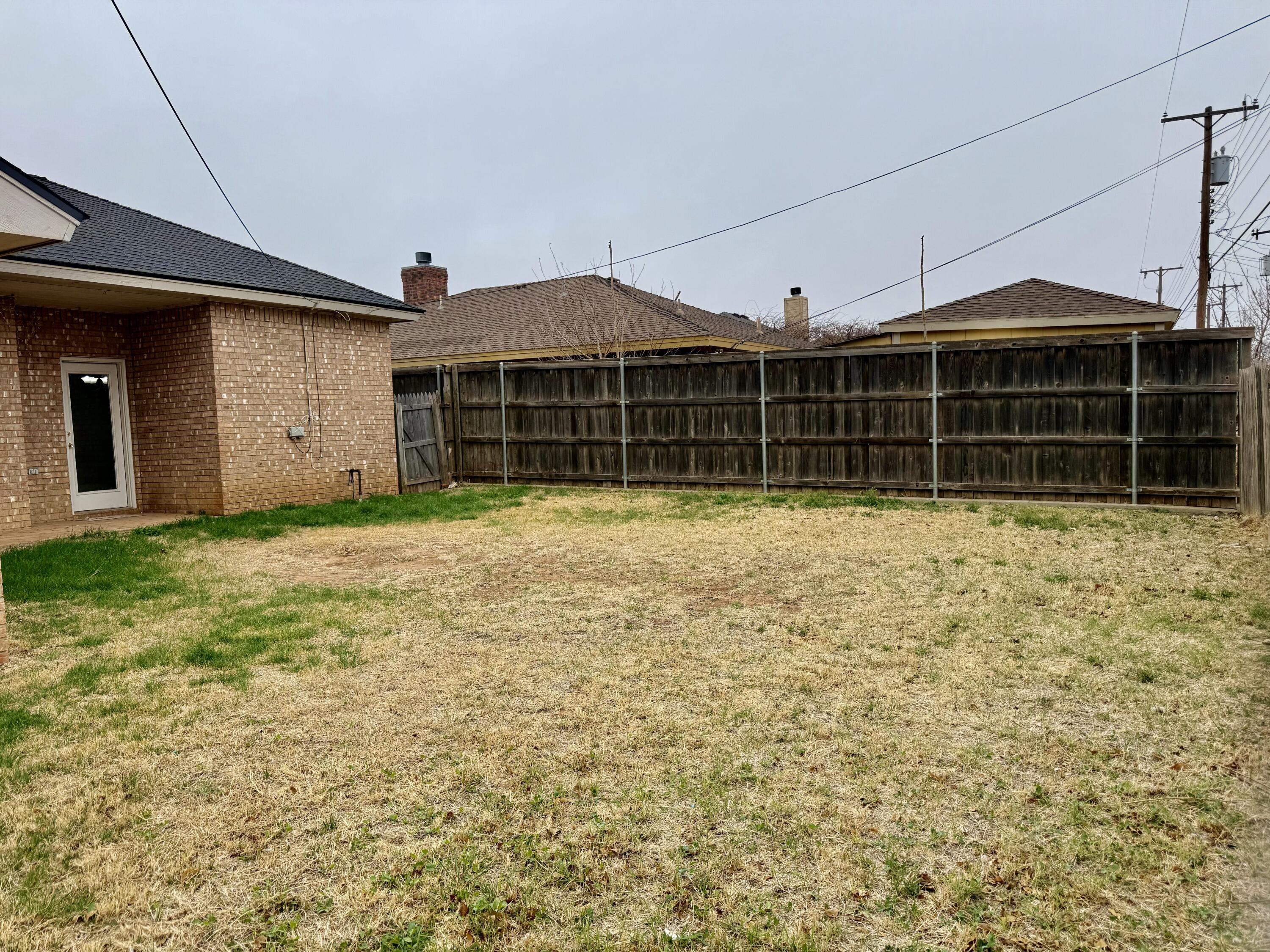 1918 75th Street Lubbock, TX 79423 - Photo 13 of 15 a view of a house with a yard