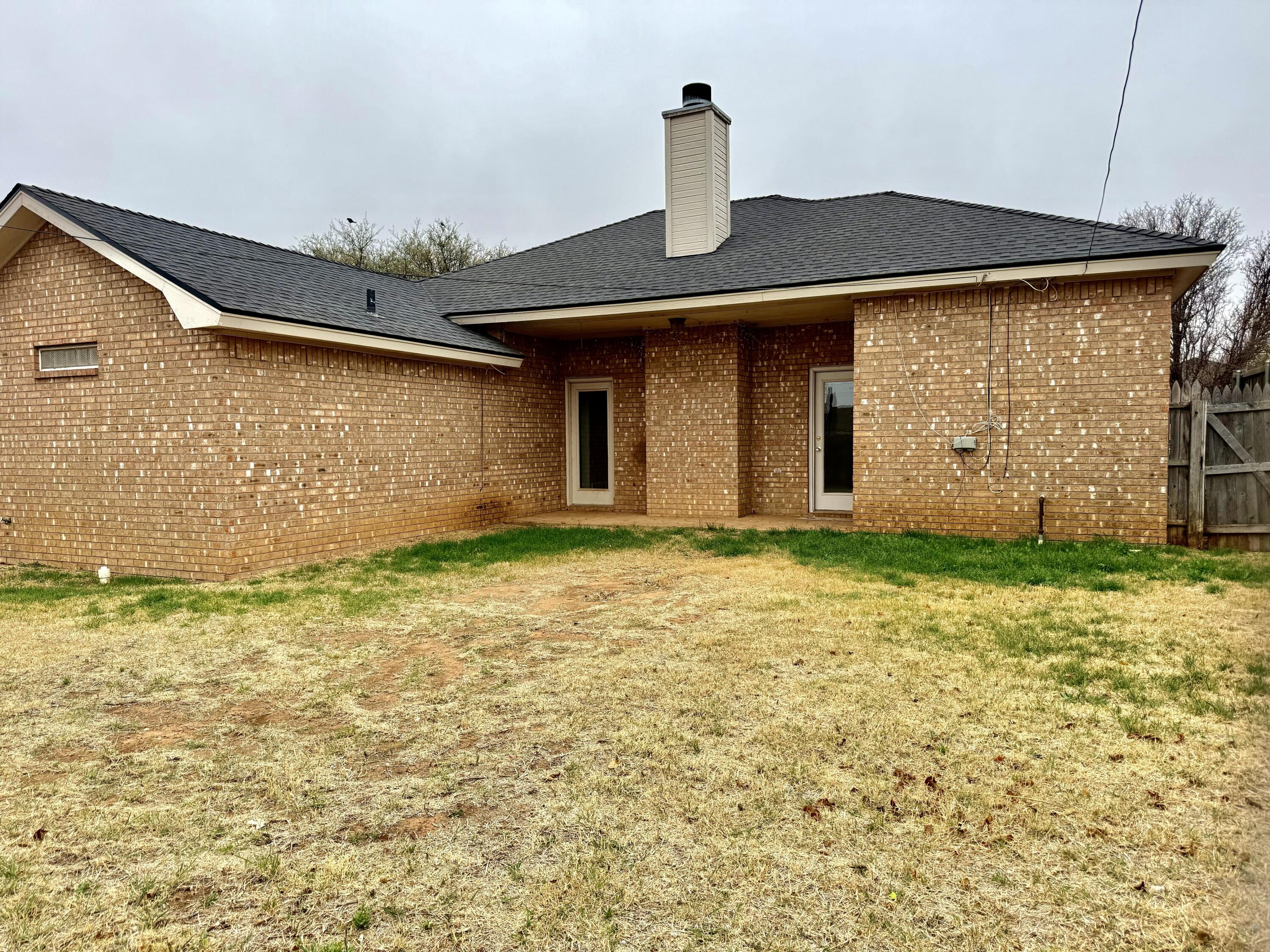 1918 75th Street Lubbock, TX 79423 - Photo 14 of 15 a front view of a house with a yard