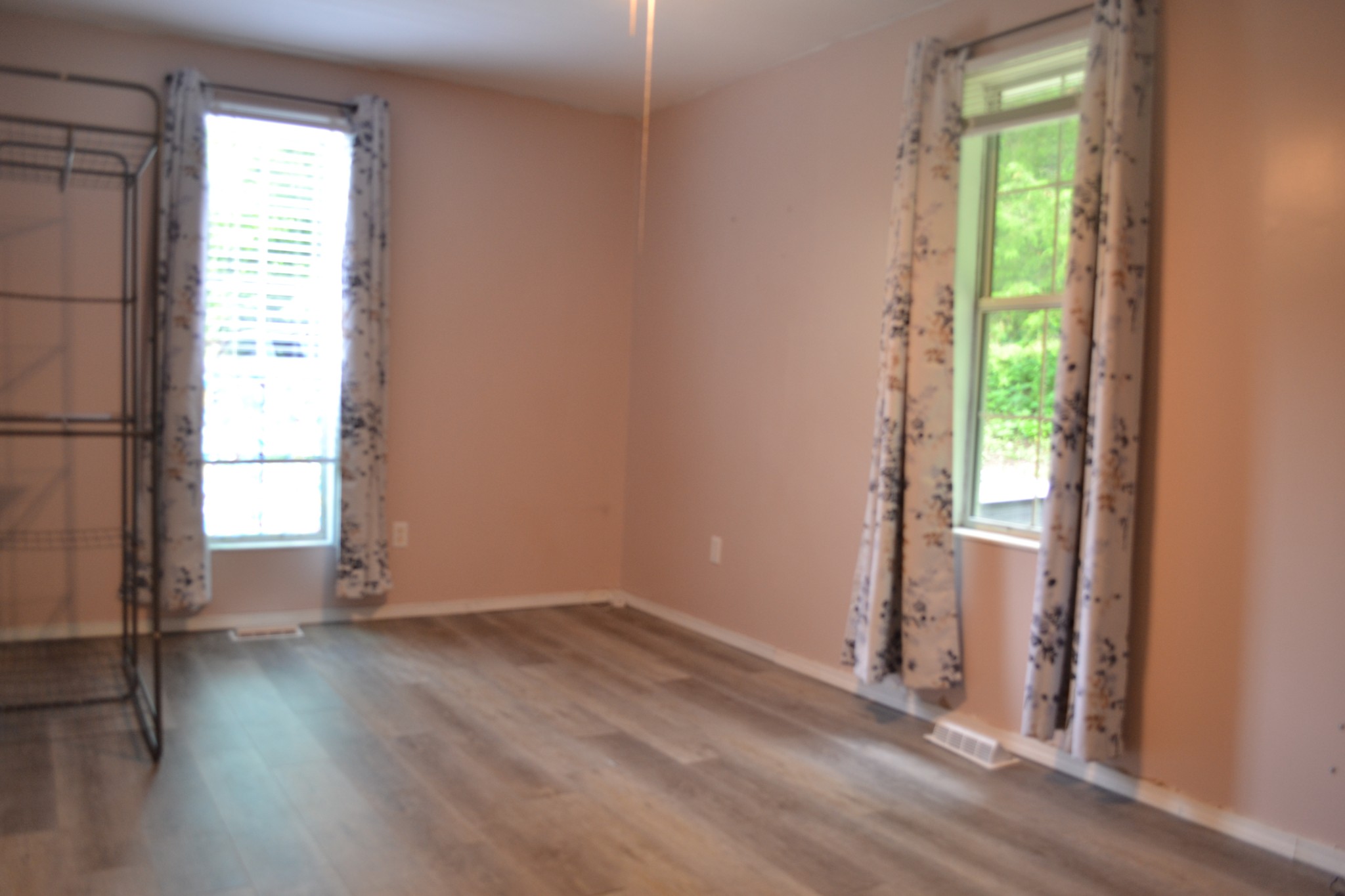 1505 Add Stafford Road Hilham, TN 38568 - Photo 18 of 65 an empty room with wooden floor and windows