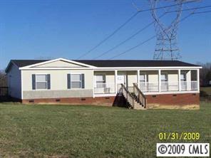 3310 Edwards Road Wingate, NC 28174 - Photo 1 of 5 a front view of a house with a yard