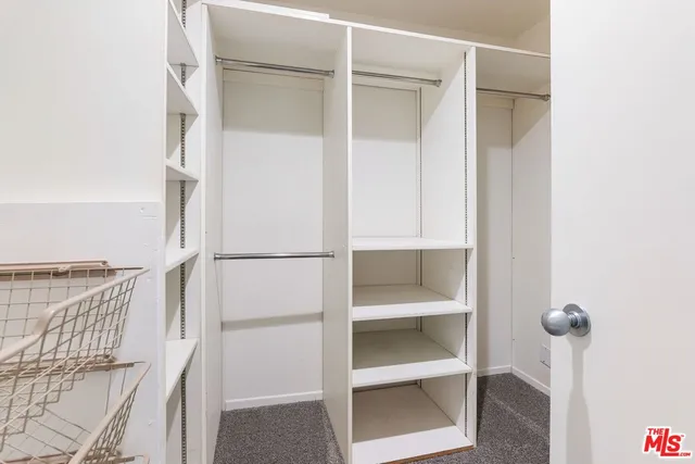 a view of an empty walk in closet