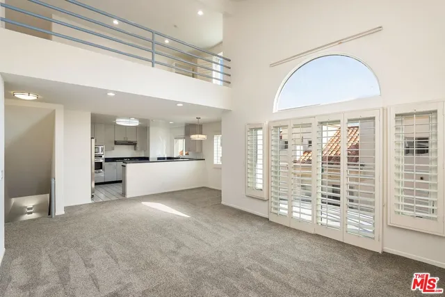 a view of a kitchen with a sink and cabinets