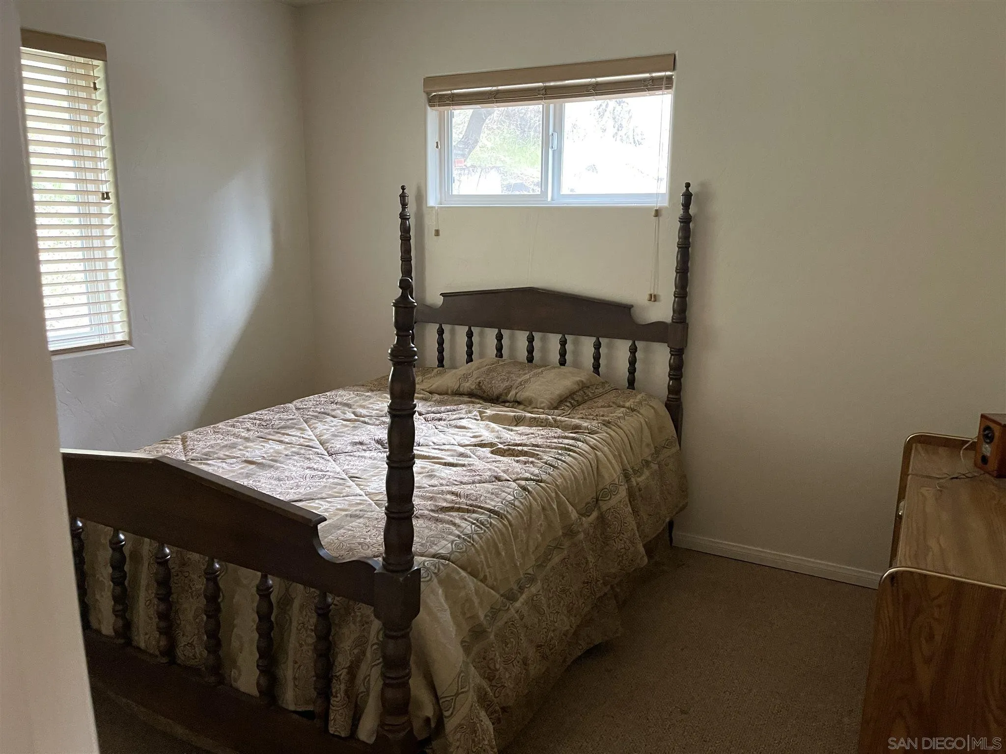 5885 Grandview Road Julian, CA 92036 - Photo 8 of 12 a bed sitting in a bedroom next to a window