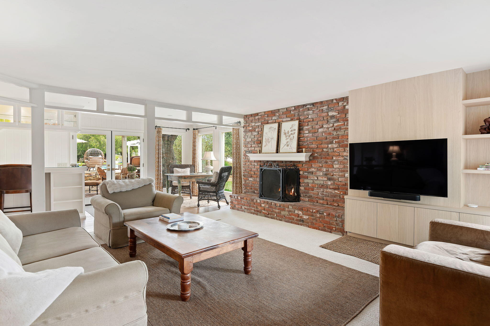 0 Still Meadow Road Solvang, CA 93463 - Photo 4 of 57 a living room with furniture a flat screen tv and a fireplace