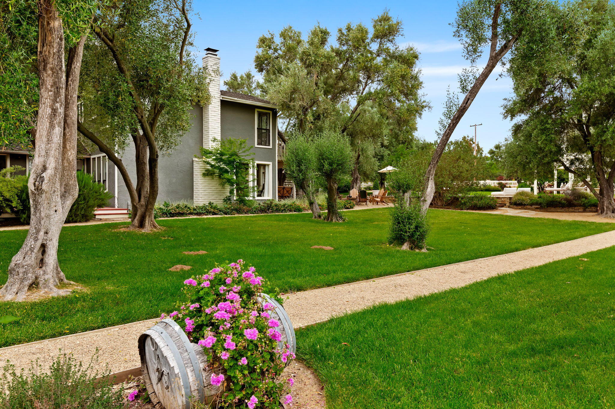 0 Still Meadow Road Solvang, CA 93463 - Photo 53 of 57 a front view of a house with a yard and fountain in middle
