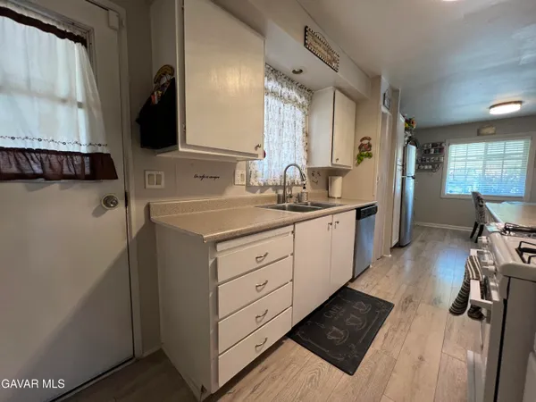a kitchen with a sink and cabinets