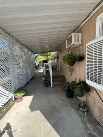 a view of a backyard with sitting area