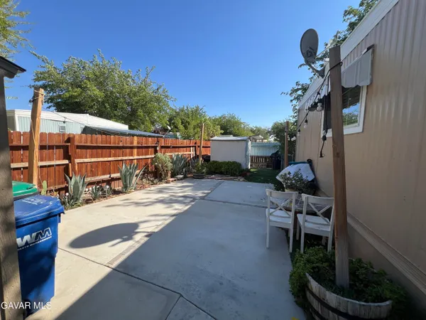 a view of house with patio outdoor seating and entertaining space