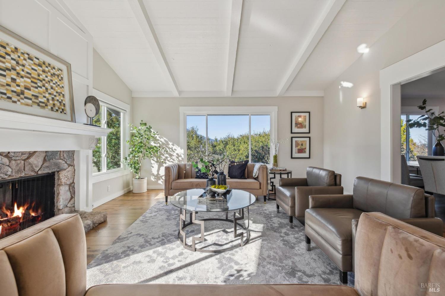 981 Greenhill Road Mill Valley, CA 94941 - Photo 13 of 91 a living room with furniture a fireplace and a large window