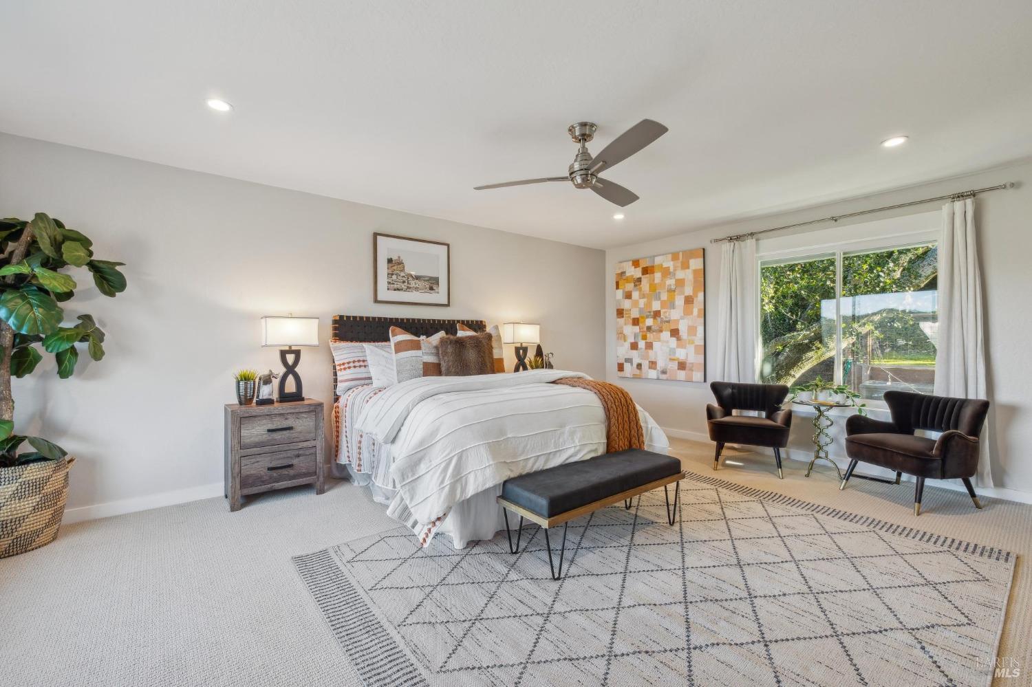 981 Greenhill Road Mill Valley, CA 94941 - Photo 32 of 91 a spacious bedroom with a bed a couch and potted plant