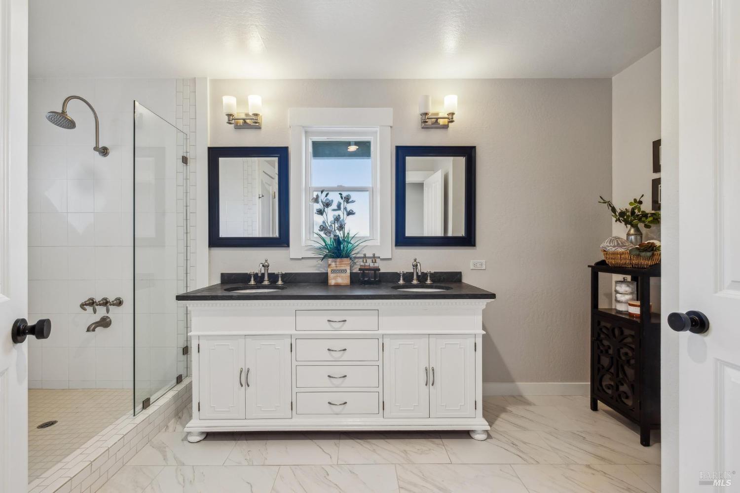 981 Greenhill Road Mill Valley, CA 94941 - Photo 37 of 91 a bathroom with a granite countertop sink a mirror a vanity and a bathtub