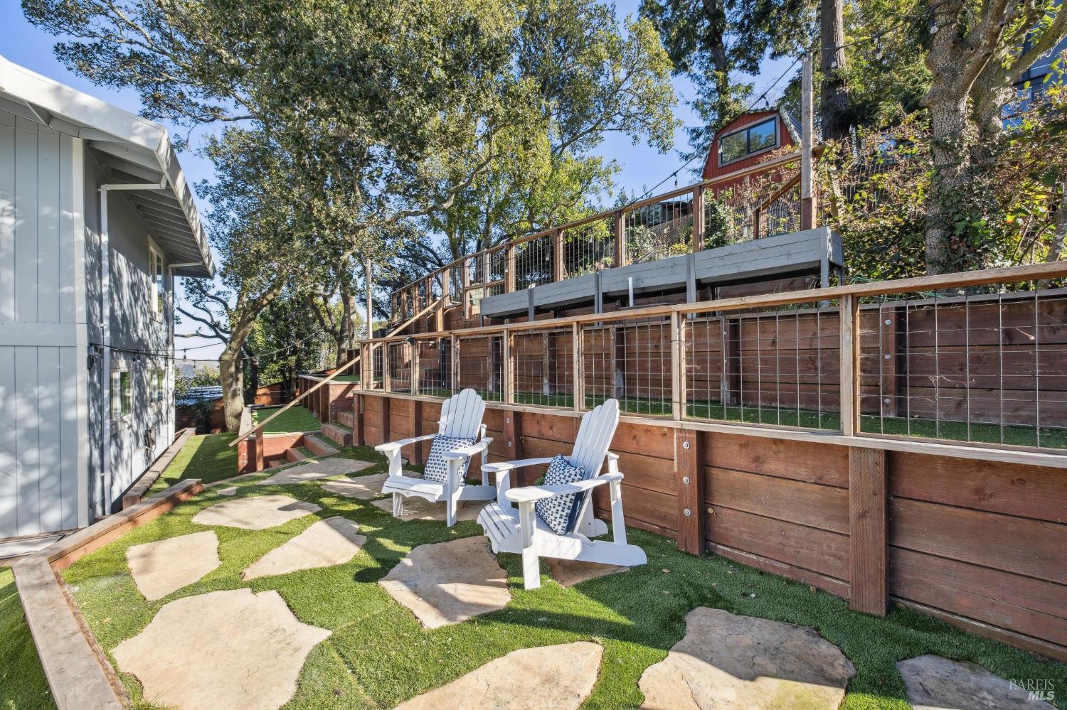 981 Greenhill Road Mill Valley, CA 94941 - Photo 72 of 91 a roof deck with table and chairs and potted plants