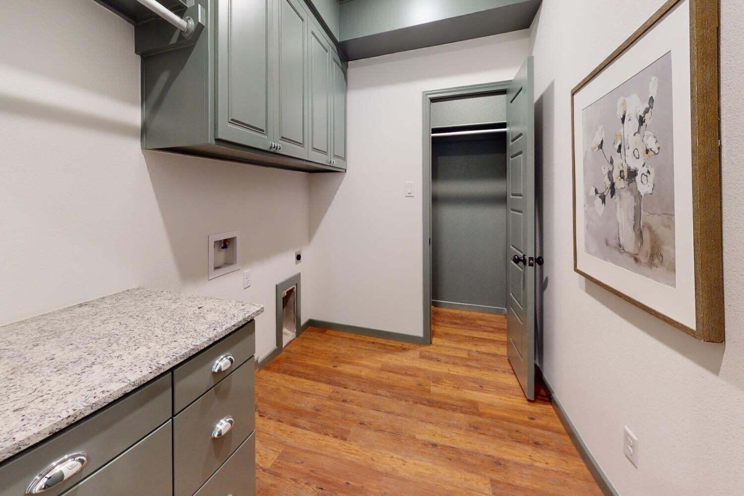 3617 128th Street Lubbock, TX 79423 - Photo 24 of 30 a view of a kitchen cabinets and wooden floor