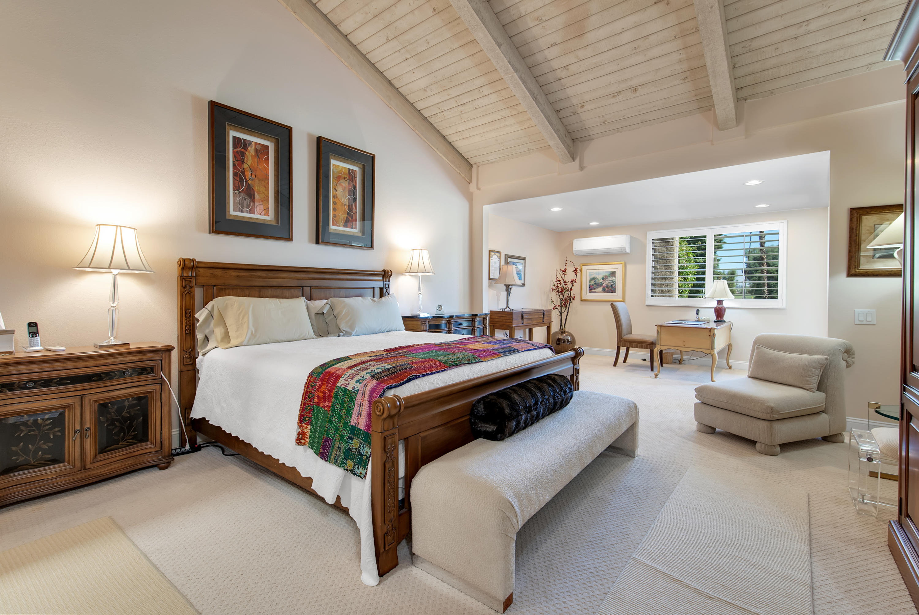 77920 Cherokee Road Indian Wells, CA 92210 - Photo 14 of 39 a spacious bedroom with a bed and glass windows
