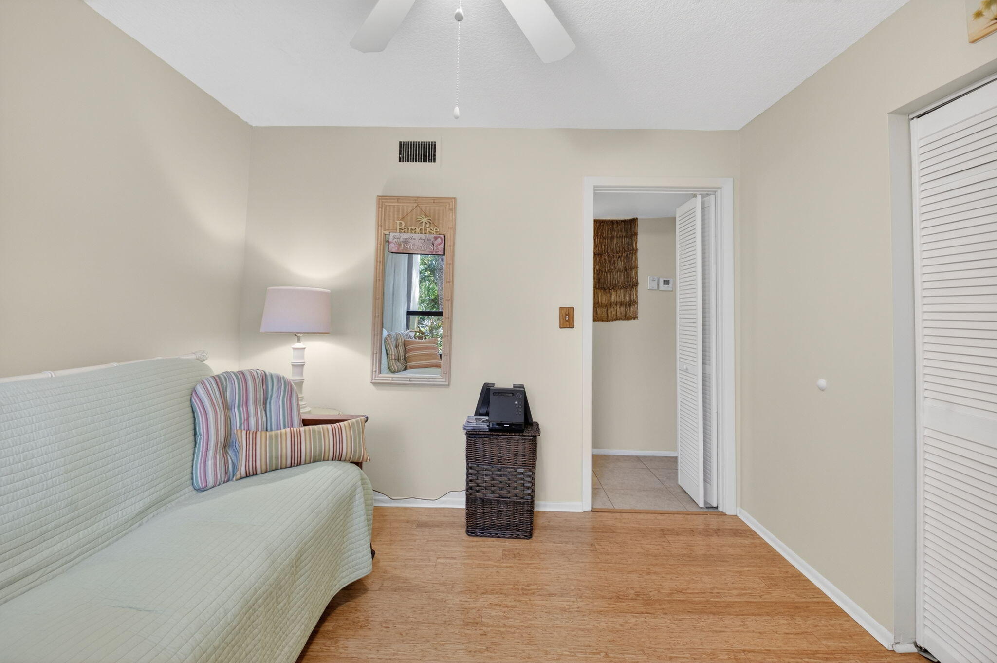 501 Dotterel Road, Unit 26B Delray Beach, FL 33444 - Photo 25 of 48 a living room with furniture and a lamp