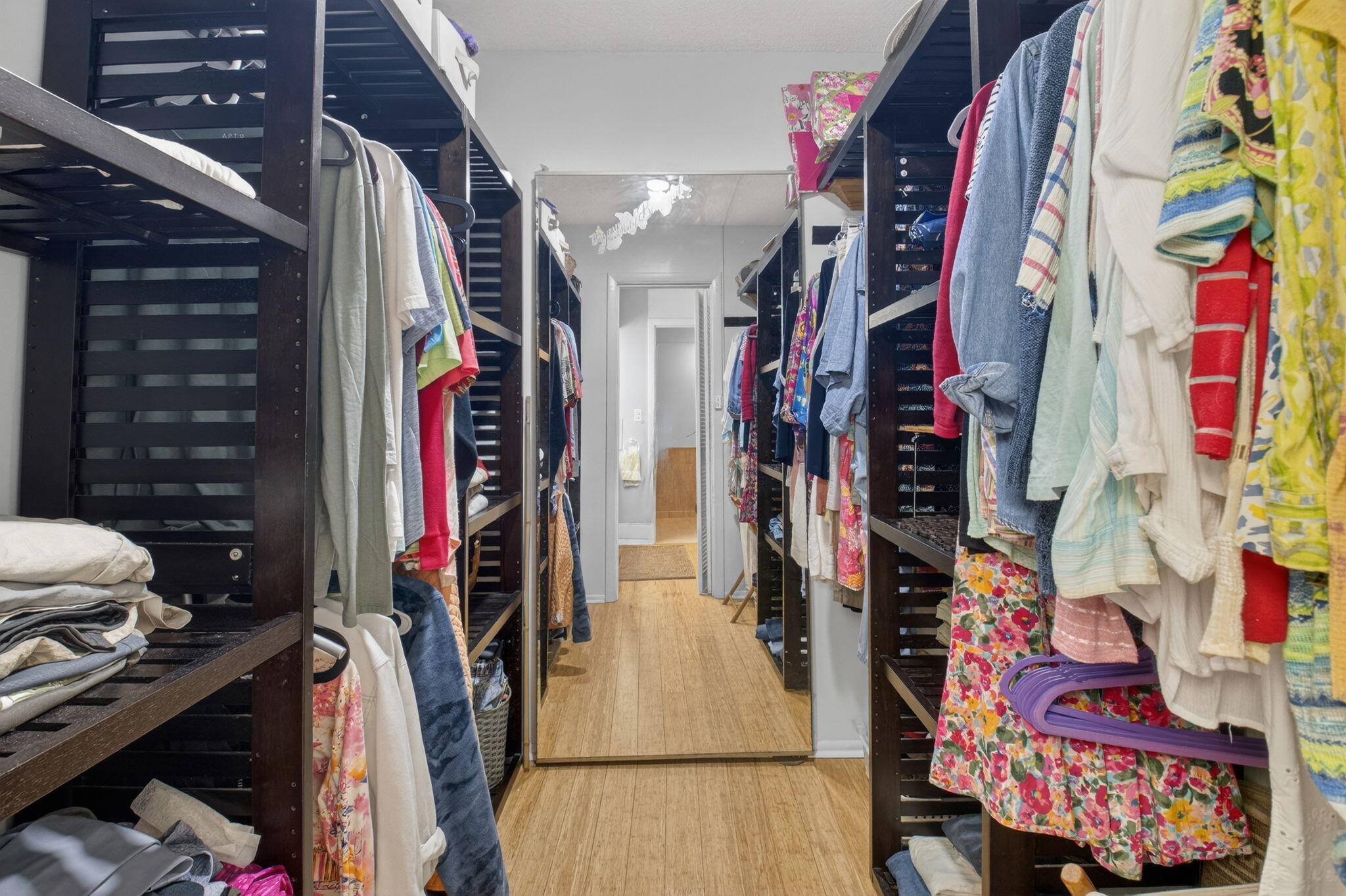 501 Dotterel Road, Unit 26B Delray Beach, FL 33444 - Photo 33 of 48 a view of walk in closet with clothes