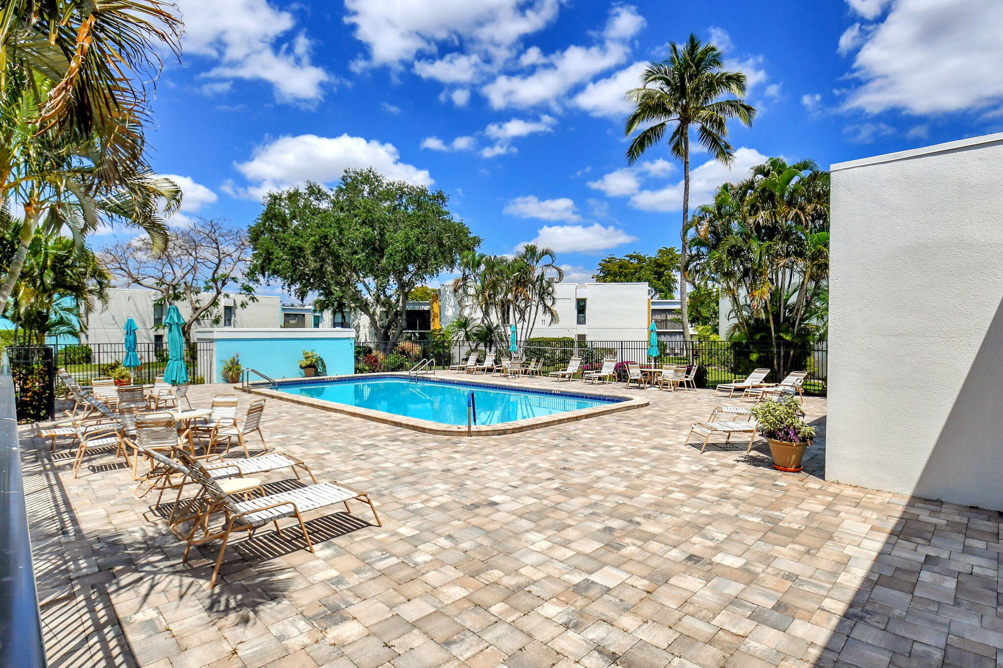 501 Dotterel Road, Unit 26B Delray Beach, FL 33444 - Photo 45 of 48 a view of a swimming pool with a patio