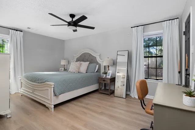 a bedroom with a bed and window