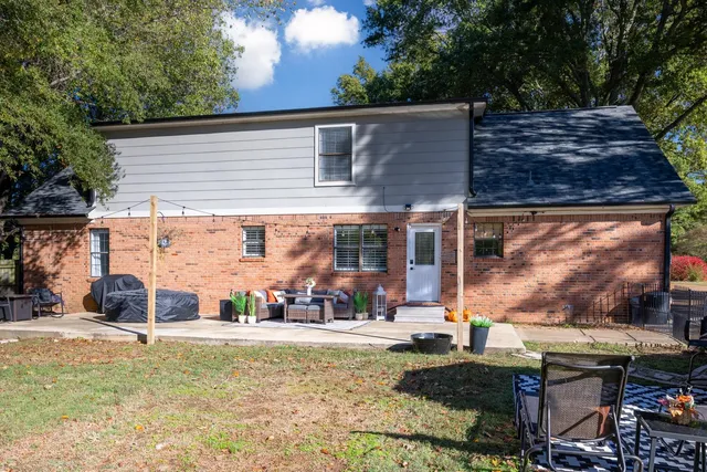a view of a chairs and table in the patio