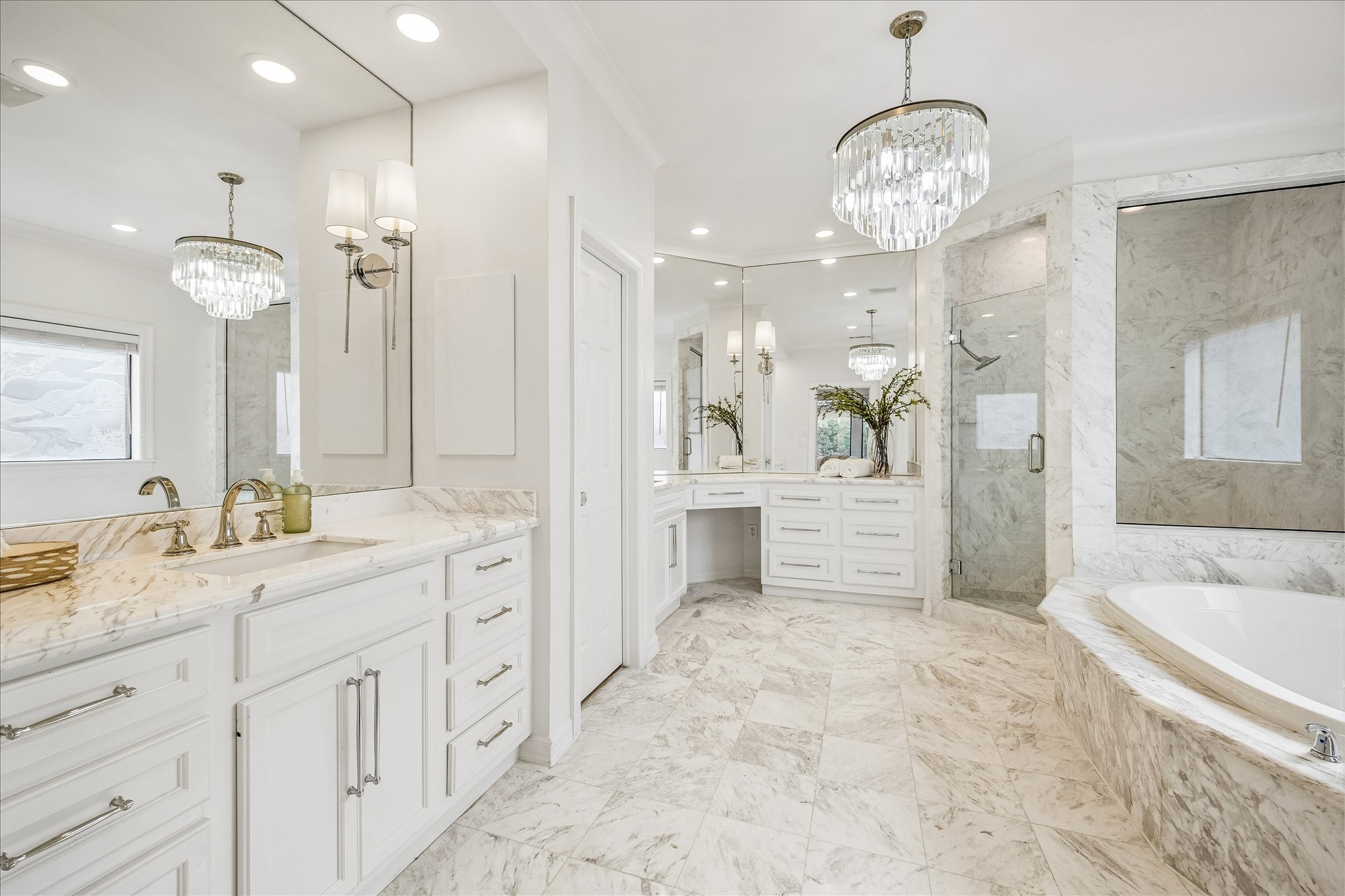 4614 Spruce Street Bellaire, TX 77401 - Photo 18 of 30 a spacious bathroom with a granite countertop sink a mirror a bathtub and shower