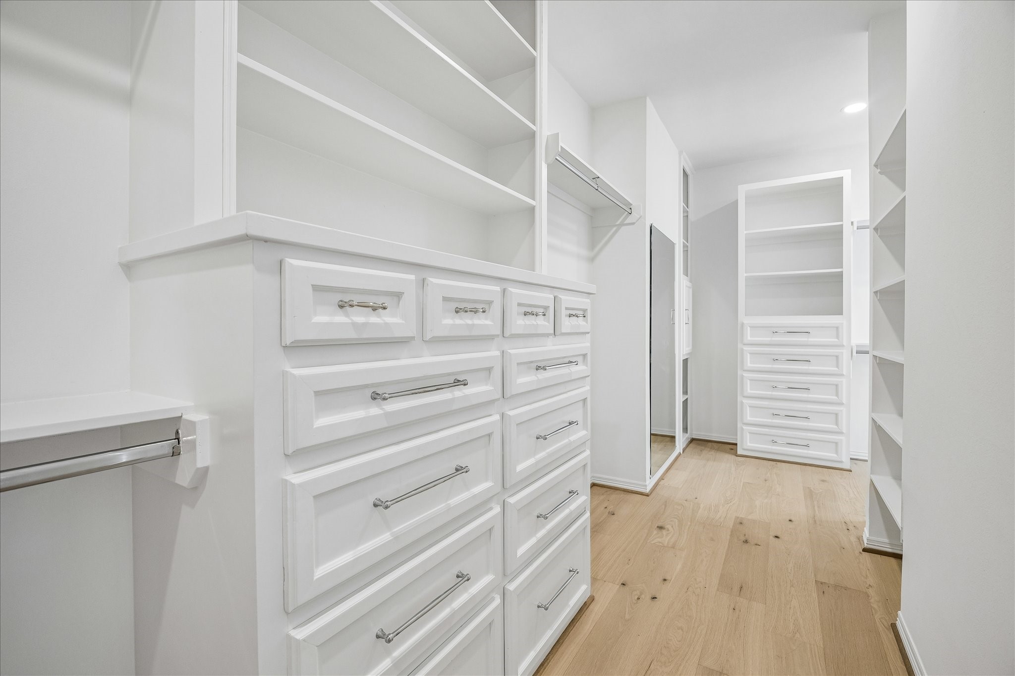 4614 Spruce Street Bellaire, TX 77401 - Photo 20 of 30 a view of walk in closet with empty racks