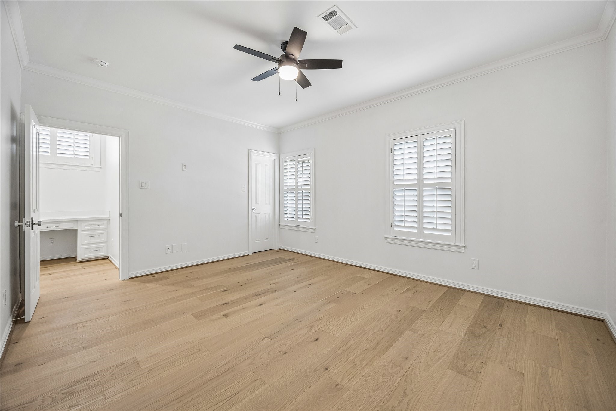 4614 Spruce Street Bellaire, TX 77401 - Photo 25 of 30 wooden floor in an empty room with a window