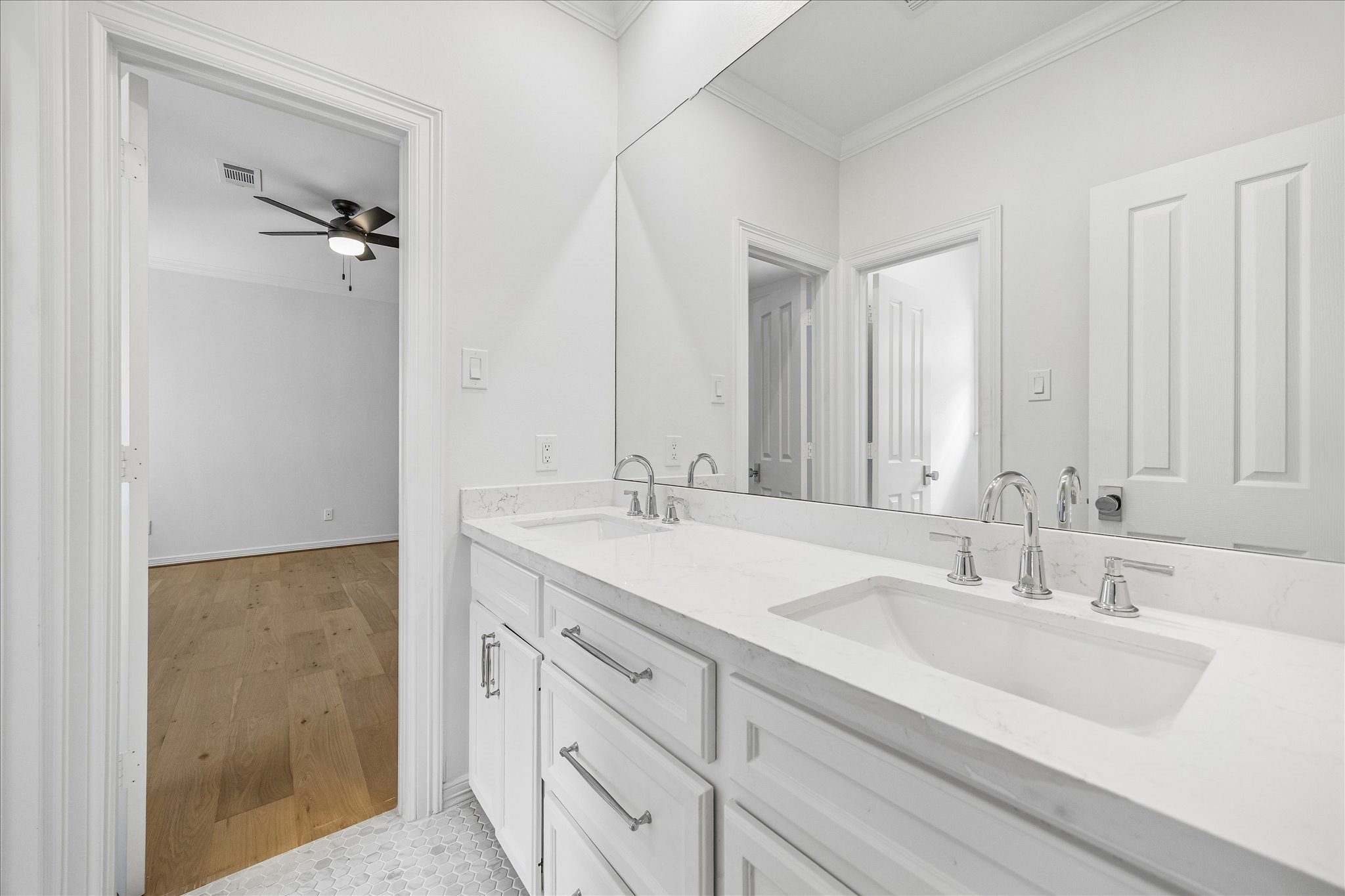 4614 Spruce Street Bellaire, TX 77401 - Photo 26 of 30 a bathroom with a double vanity sink and a mirror