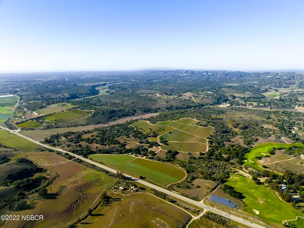 an aerial view of a house with a lake view