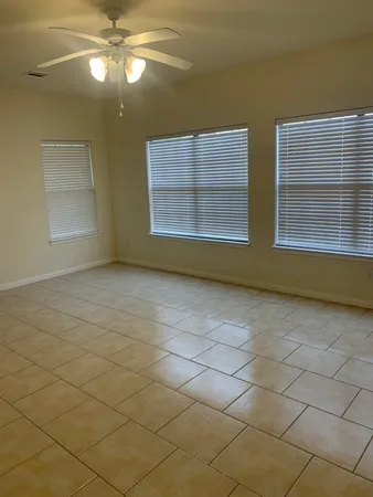 a view of empty room with a fireplace