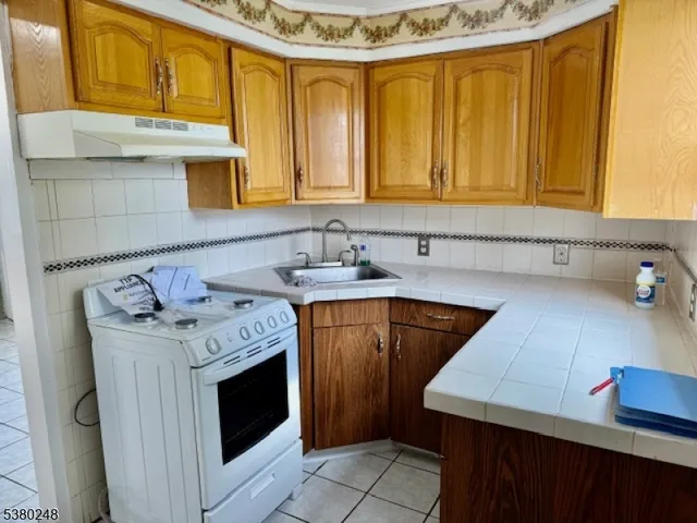 a utility room with a sink a washer and dryer