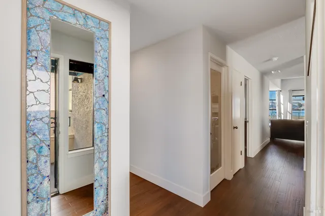 a view of kitchen with stainless steel appliances granite countertop a refrigerator and a sink