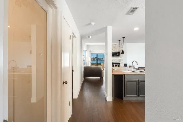a kitchen with a sink and cabinets