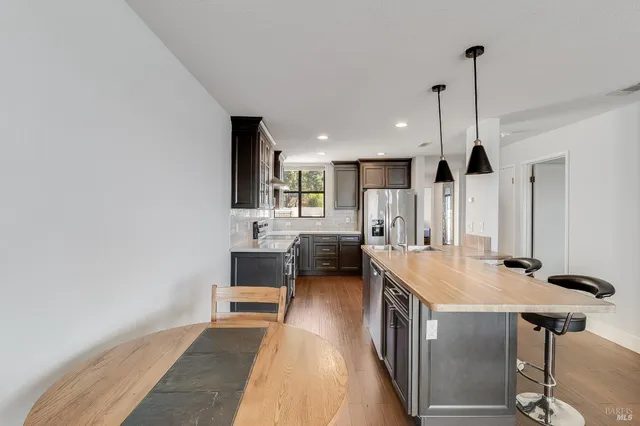 a bedroom with a bed a fireplace and window